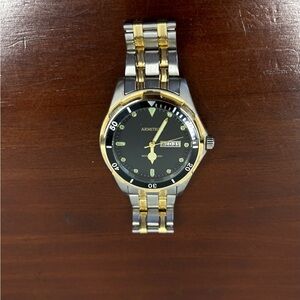 Armitron Black Dial Watch with Silver and Gold Band